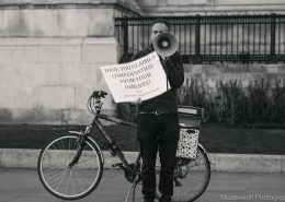 man holding placard